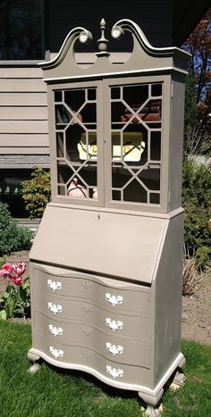 an old dresser is sitting in the grass