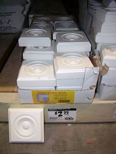 several white speakers are stacked on top of each other