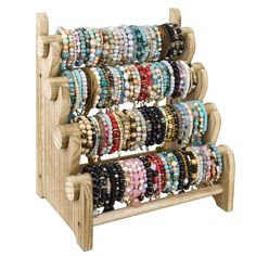 a wooden rack with bracelets on it