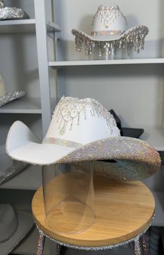 If a discount is present, it applies only to clear and clear ab stones. All other colors will have a surcharge after purchase.   I want to point out that each hat is hand-crafted. They are not without blemishes and there are no refunds as each hat is custom-made. 1) What date do you need your hat by? 2) If you know your hat size (E.g. 7 1/8) tell us. If not, watch these two YouTube videos. Measure with a SOFT tape.... Youtu.be/AwF7euDtI68 .... Youtu.be/WlDH956DMuI -Add rhinestone text for $7 per letter. Add vinyl text or logo. Price is dependent on design. Primary color= Stone color. Secondary= Hat color. Shop link for more products- www.etsy.com/shop/RhinestoneRodeo7 White Party Hat With Rhinestones, Silver Party Hat With Bling, Fringe Cowgirl Hat, Space Costume, Bridesmaids Outfits, Space Costumes, Hat Western, Wedding Country, Diy Rhinestone