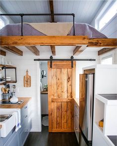 the kitchen is clean and ready to be used as a bedroom in this tiny house