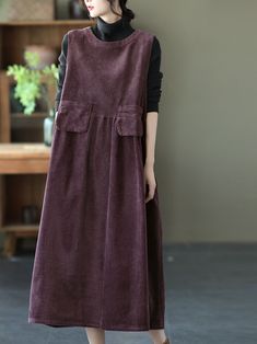 This autumn corduroy vest skirt is a loose sleeveless A-line dress in brown and black. It's made from a soft. durable corduroy material and features a round neckline. The dress has an easy pullover style that makes it easy to wear with just about anything. The length is 113cm / 44.4inch. which means you can wear it with flats for work or heels for a night out on the town! The bust size is 110cm / 43.3inch. which means it will fit most women comfortably without being too tight or too loose. Mater Flats For Work, Corduroy Vest, Vest Skirt, Corduroy Material, Swimsuits Hot, Womens Fall, Fall Dresses, Purple Dress, Lingerie Set