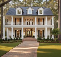 a large white house with black shutters on the front and side windows, surrounded by trees