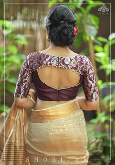 Rich fabric, a trendy back, and a stylish cut, it has all the right elements that make a perfect blouse. The attention to detail further enhances it and gives the blouse a great finish.From planning a distinct look for a new saree to upcycling an old saree, this blouse is your perfect companion as it can be paired with many drapes and effortlessly amp up all your looks. Need minor customizations? Ask us and we will try our best to make it happen! SIZE GUIDE : To determine your blouse size, pleas Banarsi Saree Blouse Design, Banarsi Suit, Blouse For Saree, Plain Blouse Designs, Brocade Blouse Designs, Lace Blouse Design, Cutwork Blouse, Model Blouse, Latest Blouse Designs Pattern