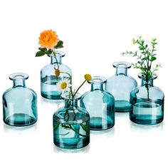 PRICES MAY VARY. Simple Glass Bud Vase: This elegant small glass vase combines the minimalist style well with chic color. The modern vase gives an eclectic feel and also adds a unique charm to any room. They are sthylish enough to appreciate on their own, and they simultaneously highlight the unique beauty of your plants when paired with flowers. Well Crafted Vase for Flowers: Made of thick glass, this small vase is more durable, heavy, sturdy and stable. The clear glass vase and green glass vas Mini Vase Centerpiece, Flowers Wedding Table, Minimalist Wedding Reception, Vases For Centerpieces, Vases Centerpieces, Glass Vases Centerpieces, Vases For Flowers, Modern Centerpieces, Small Glass Vases