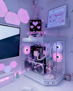 a white computer case sitting on top of a desk next to a monitor and keyboard