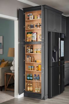 an open refrigerator in the middle of a kitchen