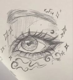 a drawing of an eye with stars around it