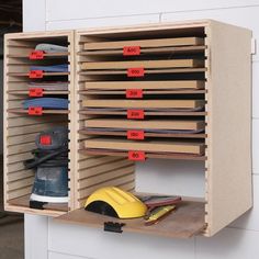 a pair of work shoes are on the shelf next to a shoe rack that holds several pairs of work shoes