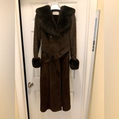 This Is A Full Length Shearling Coat In Dark Brown Suede. It Is Not Sized, So I Am Adding Measurements. It Fit Between A Size 4 And 6, But Best On A 4. It Is 100% Shearling And Incredibly Warm. Non-Smoking Home. Length: From Collar To Bottom Of Hem Is 45 In. Width: Shoulder To Shoulder: 15 Inches. Waist With Coat Buttoned: 31 Inches. Arm Length: Shoulder To Bottom Of Fur Cuff: 23 In. If You Want Any Further Measurements, Please Ask. There Are No Apparent Flaws. The Only Thing Is That Underneath Fitted Mink Outerwear For Work, Fitted Fur Coat With Faux Fur Lining For Work, Thrift Manifestation, Full Length Coat, Shearling Coat, Brown Suede, A 4, Dark Brown, Full Length