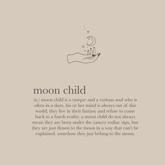 a hand holding a candle with the words moon child on it, in black and white