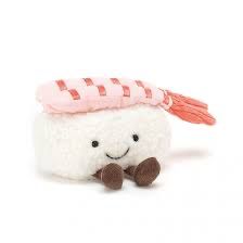 a small stuffed animal with a pink hat on it's head