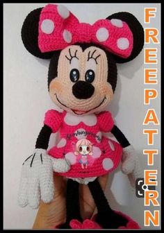 a crocheted minnie mouse stuffed animal in pink and white