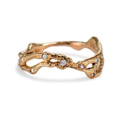 a gold ring with diamonds on it