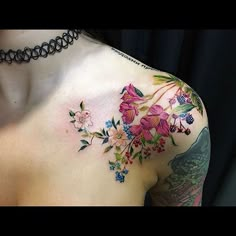 a woman's chest with flowers on it