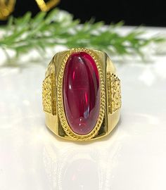 Vintage 15K Yellow Gold Ruby Cabochon Unisex Ring ...Marked 610 and tested 15K Gold...Total of weights 8.0grams...Size 9.5...Measure of Face 22.5MM...It's in very good condition. Gold Ruby Signet Ring With Polished Finish, Classic Gold Ruby Cabochon Ring, Classic Gold Ruby Ring With Cabochon, Gold Ruby Ring Oval Cabochon With Polished Finish, Oval Ruby Rings In Gold, Gold Ruby Ring Oval Cabochon For Anniversary, Gold Ruby Ring With Oval Cabochon For Anniversary, Anniversary Gold Ruby Ring With Oval Cabochon, Gold Cabochon Ruby Ring For Weddings