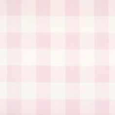 a pink and white checkered fabric with a ruler