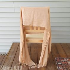 a wooden chair sitting on top of a wooden floor