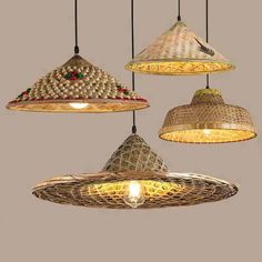 three hanging lights that are made out of wicker