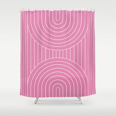 a pink shower curtain with circles in the middle and white lines on it's sides