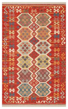 an orange and red rug with geometric designs