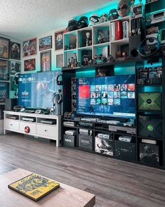 a living room filled with furniture and a flat screen tv sitting on top of a wooden floor