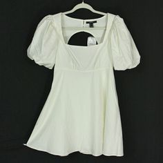 Pretty Dress From Forever 21 In Classic Ivory. Brand New With Tags. ~Puff Sleeves With Elastic Cuffs ~Empire Waist With Small Gathers On The Front ~Open Back With Button Closure At The Neckline ~Fully Lined With 100% Polyester ~45% Rayon, 27% Linen, 26% Cotton, 2% Spandex Shell ~Hand Wash This Dress Is New With Tags And Is Ready For You To Rock It! Please See Measurements Below And View The Pictures As They Are Part Of The Description. Measurements~ All Measurements Are Approximate Size: Tag Say Summer Cream Puff Sleeve Mini Dress, Summer Cream Mini Puff Sleeve Dress, Forever 21 White Short Sleeve Dresses, Princess Sleeves, Linen Mini Dress, Forever 21 Dresses, Empire Waist, Forever 21, Puff Sleeve