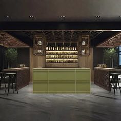 an empty bar with lots of bottles on it