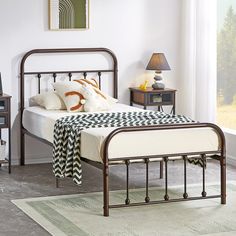 a bedroom with a bed, night stand and two nightstands