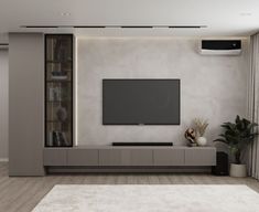 a modern living room with a flat screen tv on the wall