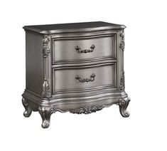 a silver nightstand with two drawers on the bottom and one drawer open to reveal an ornate design