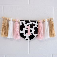 Are you planning a Cowgirl My First Rodeo Birthday Photoshoot or Cake Smash? The perfect addition to any of our Rodeo theme items in seperate listings. Please search our store for "Rodeo" to see the full range :) DETAILS white and black cowprint acrylic flag white and pink acrylic "1" handmade wool tassles flag is 13cm x 10cm fits to a standard size high chair garland (easy to fit with some household removable hooks) SHIPPING  We currently ship within Australia and Internationally to USA, NZ and Cowgirl High Chair Banner, Cow First Birthday Theme, Cowgirl Themed First Birthday, Rodeo Birthday Photoshoot, First Rodeo Birthday Decorations, Cowgirl First Birthday, Cowgirl Birthday Cakes, My First Rodeo Birthday, High Chair Garland