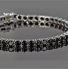 Men's Tennis Bracelet, Round Cut Black Lab-Created Diamond, 925 Sterling Silver, Gift for Men's ,Wedding Gift,14K White Gold Plated Customized product returns will NOT BE Accepted. ✤Details✤ Handmade item Ships from a small business in India Materials: Yellow Gold, Rose Gold, White/Silver Gold Gemstone: Diamond Gem color: Black  Band color: White  Style: Boho & hippie Can be personalized Made to Order ✤Description✤ The most unique jewelry you can find, the perfect gift for you and your loved one Black Bangle For Anniversary, Black Bangle Jewelry For Anniversary, Classic Black Diamond Bracelet For Anniversary, Formal Black Sterling Silver Round Bracelet, Formal Black Round Sterling Silver Bracelet, Black Bangle Bracelet For Anniversary, Black Jubilee Bracelet For Anniversary, Classic Black Sterling Silver Bracelet, Classic Black Sterling Silver Jubilee Bracelet