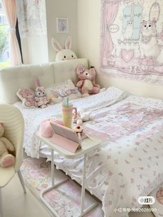 there is a small child's bedroom with pink decor and teddy bears on the bed