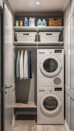 a washer and dryer in a closet with clothes hanging on the shelves next to each other