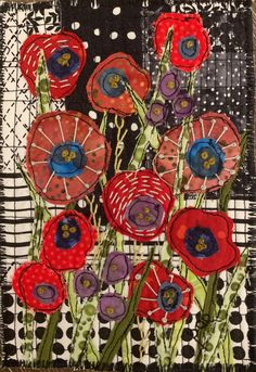 an art quilt with red and purple flowers on it