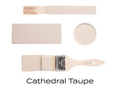 a white paint brush with the words cathedral taupe on it's side and other tools