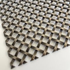 a piece of metal mesh sitting on top of a table