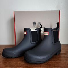 Classic Wellies Brand Hunter And Their Beautiful Chelsea Rain Boot. Color Black Ice. Great Peice To Elevate Any Outfit. Size: 9m New In Box, New With Tags Please See Photos For Condition And Details. Please Let Me Know If You Have Any Questions. Offers Are Welcome! Statement Closet Cleanout Thrift Second Hand Sustainable England Welly Wellies Rain Boot Princess Kate Statement Closet Staple Oxford Old Money Classic Neutral Simple Sporty Gray Boots With Rubber Sole, Black Boots With Cushioned Footbed And Flat Heel, Black Flat Heel Boots With Cushioned Footbed, Black Waterproof Slip-on Boots, Black Slip-on Waterproof Boots, Gray Boots With Cushioned Footbed And Round Toe, Gray Cushioned Boots With Round Toe, Gray Round Toe Boots With Cushioned Footbed, Gray Cushioned Round Toe Boots