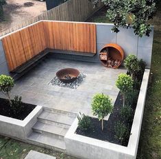 an outdoor area with concrete blocks and plants