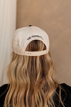 Elevate your headwear game with the God's Favorite Trucker Hat. Featuring a cream cap with a sleek black bill, this hat makes a bold statement. The front is embroidered with "God's Favorite" in stylish black embroidery, while the back adds a cheerful touch with "the happiest :)" also in black. With an adjustable back for a custom fit, this trucker hat combines comfort with a confident message, making it a standout accessory for any casual outfit. Cream Snapback Hat One Size, Cream Snapback Baseball Cap, Adjustable Cream Hats For Streetwear, Adjustable Cream Hat For Streetwear, Cream Snapback Hat With Flat Brim, Cream Adjustable Hat For Streetwear, Adjustable Cream Hat With Embroidered Logo, Cream Adjustable Snapback Hat, Adjustable Cream Snapback Hat