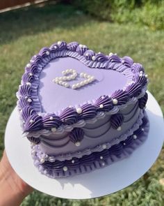 a heart shaped cake sitting on top of a white plate