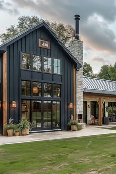 a large black house with lots of windows