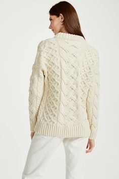 Chunky, oversized and luxurious beyond measure. The Dingle Aran Trellis Sweater with its oversized cut has the power to suit every woman. This luxurious drop shoulder sweater has a deeper double neck with ribbing at the cuffs and hem, accompanied by a traditional open basket weave stitch, making for a beautiful statement piece. Balancing comfort and style with ease. Basket Weave Stitch, Basketweave Stitch, Drop Shoulder Sweater, Aran Sweater, Homewares Shop, Drop Shoulder Sweaters, Yarn Shop, Basket Weave, Shoulder Sweater