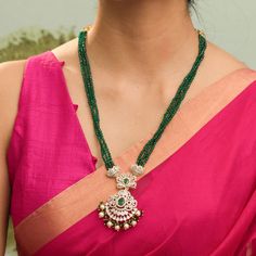 Description : Discover regal opulence with the Amira CZ necklace from Tarinika's festive collection. Inspired by classic Indian designs, this necklace is handcrafted with CZ stones & three-layer emerald beads tassel on gold polish to highlight your festive outfit. Details & Specifications: Materials used: CZ Stone with White Gold Plating Weight - Necklace 42.93 gms Length - Necklace 29 cms Make it custom Want to make it a custom necklace? Sure! Reach out to us at support@tarinika.com and we’ll b Festive Kundan Emerald Necklace For Receptions, Elegant Kundan Necklace With Gold Beads For Diwali, Traditional Kundan Emerald Necklace For Reception, Temple Jewelry Style Emerald Necklace For Celebration, Emerald Bridal Necklace With Stone Work For Festive Occasions, Temple Style Emerald Necklace For Celebrations, Traditional Emerald Necklace For Reception, Festive Temple Jewelry Emerald Necklace For Reception, Elegant Emerald Necklaces For Festivals