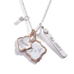 About This Personalized PieceMeasurements & MaterialsIncluded: Three personalized charms, one 22" adjustable chain and one 3mm stone charm.Charm Measurements: Ornate edged charm: 3/4"; Rectangle charm 1/4" x 1-1/4"; Flower Shaped Charm: 5/8"Charm & Chain Metal:  Sterling Silver and Golden BronzeComplementary Charms: To add additional charms to this design, please use the A La Carte Section. Charms noted below under Other Pieces You Will Love pair well with this design.MADE FROM RECYCLED SILVER Custom Engraved Necklace, Personalized Engraved Jewelry, Sisters Jewelry, Buy Earrings Online, Personalized Charm Necklace, Glamour Jewelry, Sentimental Jewellery, Sister Jewelry, Hand Stamped Necklace