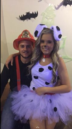 a man and woman dressed up in costumes