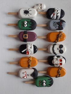 there are many halloween cupcakes on the stick