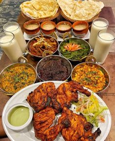 a table topped with lots of different types of food