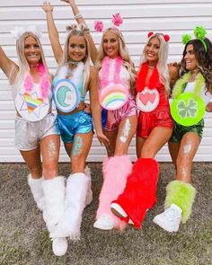 four women dressed in costume posing for the camera